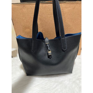 Tutilo New York Black Pebbled Faux Leather Tech Tote Bag.